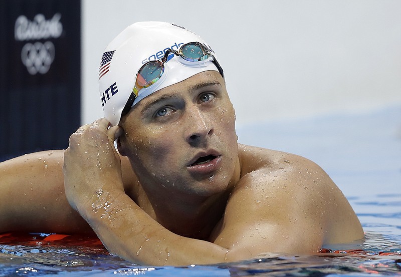 In this Tuesday, Aug. 9, 2016, file photo, United States' Ryan Lochte checks his time in a men's 4x200-meter freestyle heat during the swimming competitions at the 2016 Summer Olympics, in Rio de Janeiro, Brazil. Speedo announced Monday, Aug. 22, 2016, that they are dropping their sponsorship of Lochte. The swimsuit maker says that it doesn't condone behavior that is counter to its values. Lochte fabricated a tale that he was robbed at gunpoint in Rio de Janeiro during the Olympics. He later apologized.