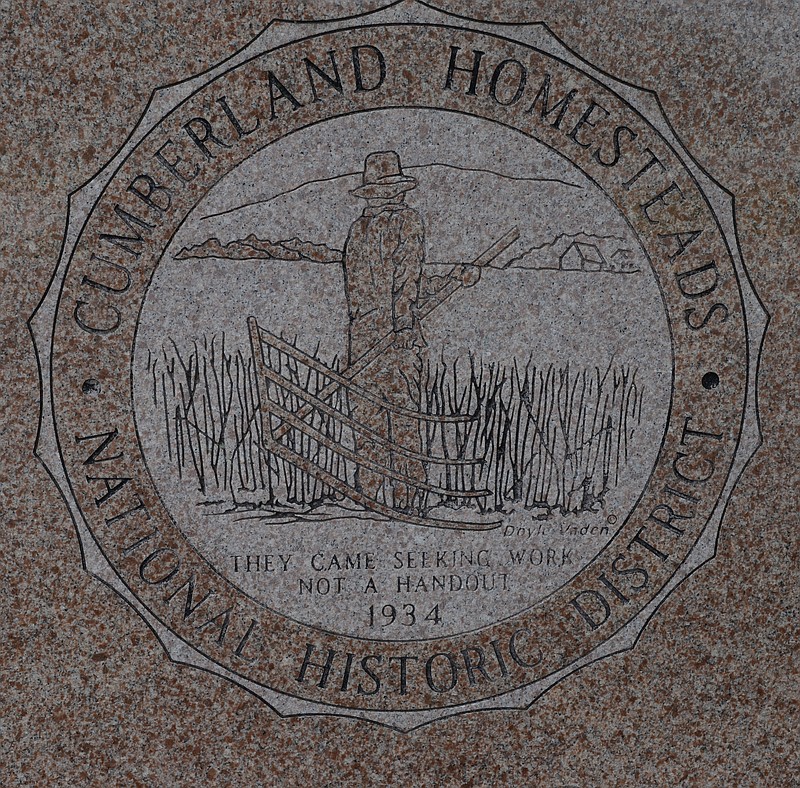 A granite marker at Homesteads Tower near Crossville gives a history of the settlement and lists family names of the founding residents.