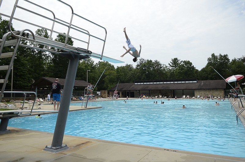 The large swimming pool at Cumberland Mountain State Park has low and high diving boards.