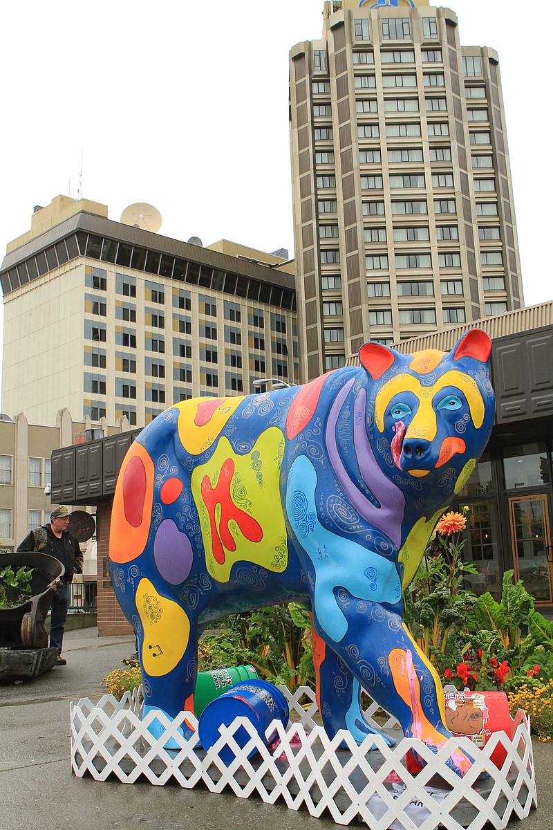 
              A life-size, painted fiberglass bear statue, part of a "Parade of Bears" display, stands in front of a an ice cream shop on Thursday, Aug. 25, 2016, in Anchorage, Alaska. The statues were installed to increase awareness of grizzly and black bears that live within the municipality of Anchorage and to highlight an international bear conference hosted by the city. (AP Photo/Dan Joling)
            