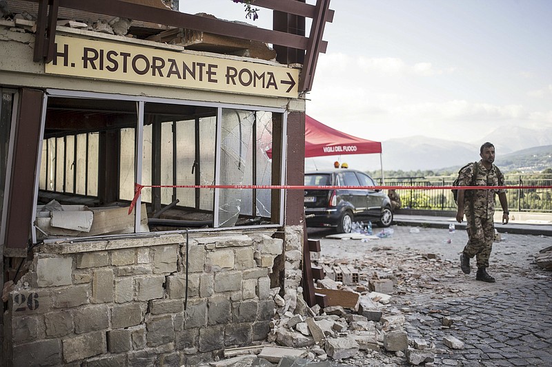 
              This picture taken on Wednesday, Aug. 24, 2016 shows the crumbling hulk of the Hotel Roma in  Amatrice, central Italy, where a strong quake had hit a few hours earlier. Strong aftershocks rattled residents and rescue crews alike Friday, Aug. 26, 2016, as hopes began to dim that firefighters would find any more survivors from Italy's earthquake. (Massimo Percossi/ANSA via AP)
            