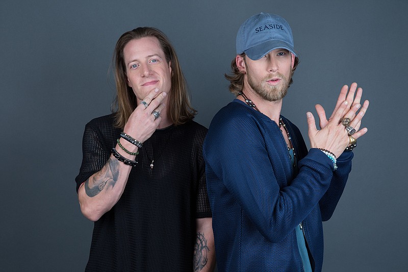 
              Tyler Hubbard, left, and Brian Kelley of Florida Georgia Line pose for a portrait on Thursday, Aug. 25, 2016, in New York. (Photo by Amy Sussman/Invision/AP)
            