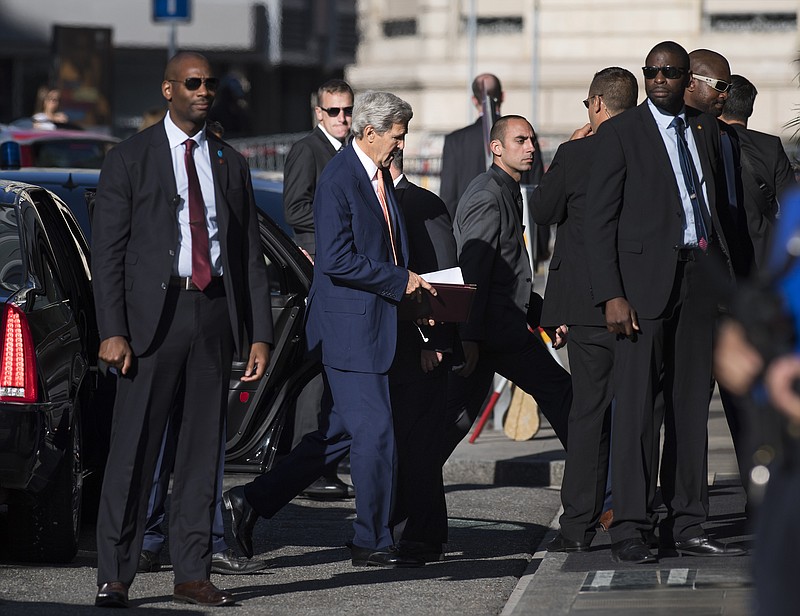 
              U.S. Secretary of State John Kerry, center, arrives for a new round of talks on Syria, in Geneva, Switzerland, Friday, Aug. 26, 2016. (Martial Trezzini/Keystone via AP)
            