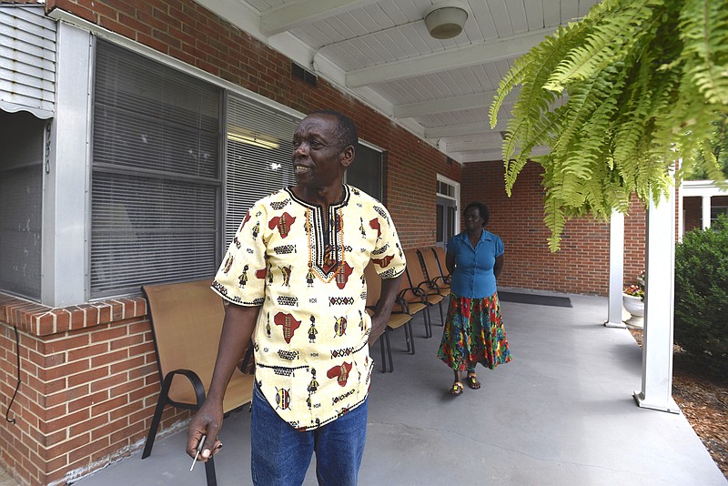 David, left, and Agnes Machoka stand Wednesday, August 23, 2016 in Friendship Haven on Dodson Avenue.