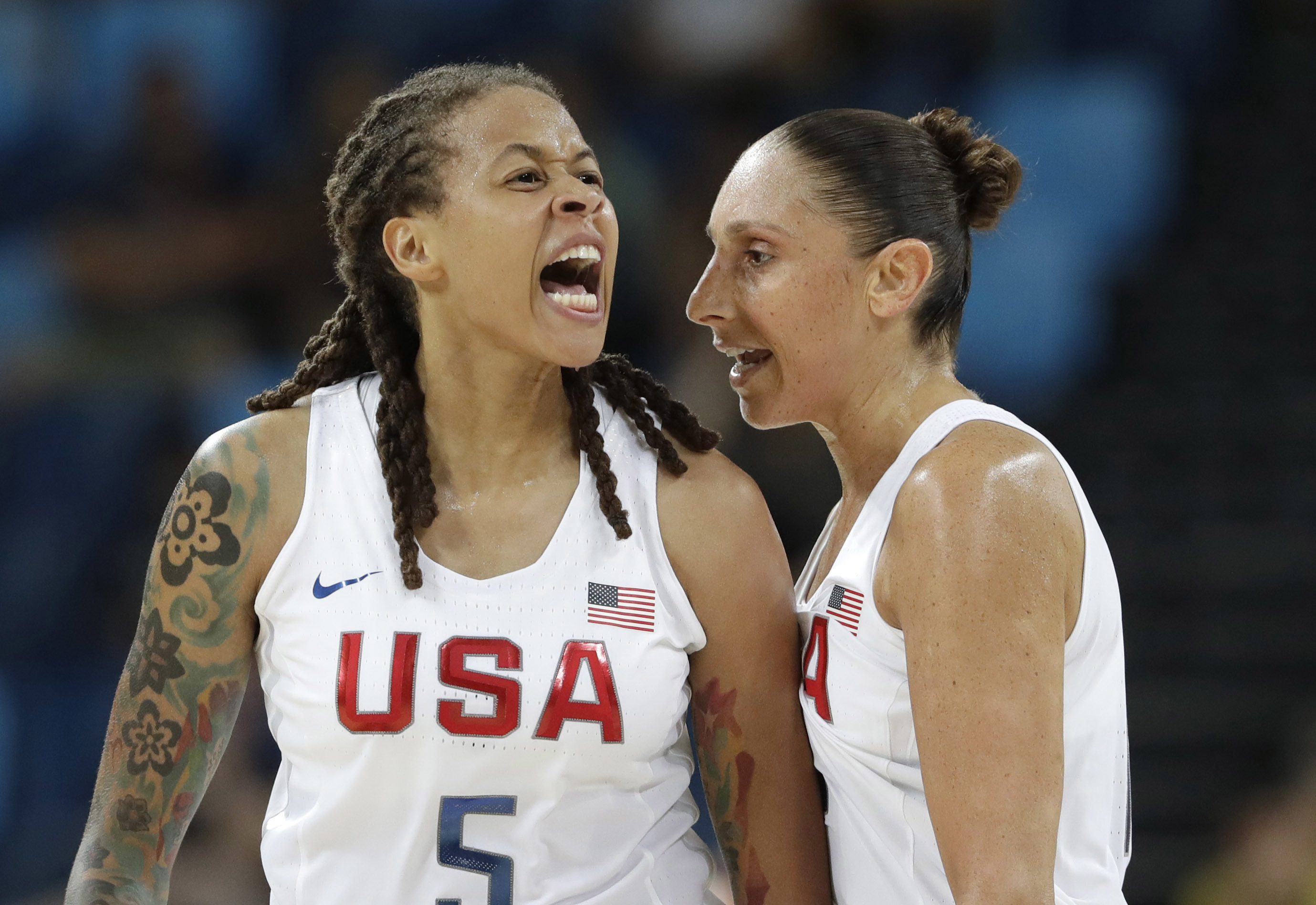 United States' Seimone Augustus (5), with teammate Diana Taurasi, reacts to a score against Japan during a women's quarterfinal round basketball game at the 2016 Summer Olympics in Rio de Janeiro, Brazil, Tuesday, Aug. 16, 2016. (AP Photo/Eric Gay)