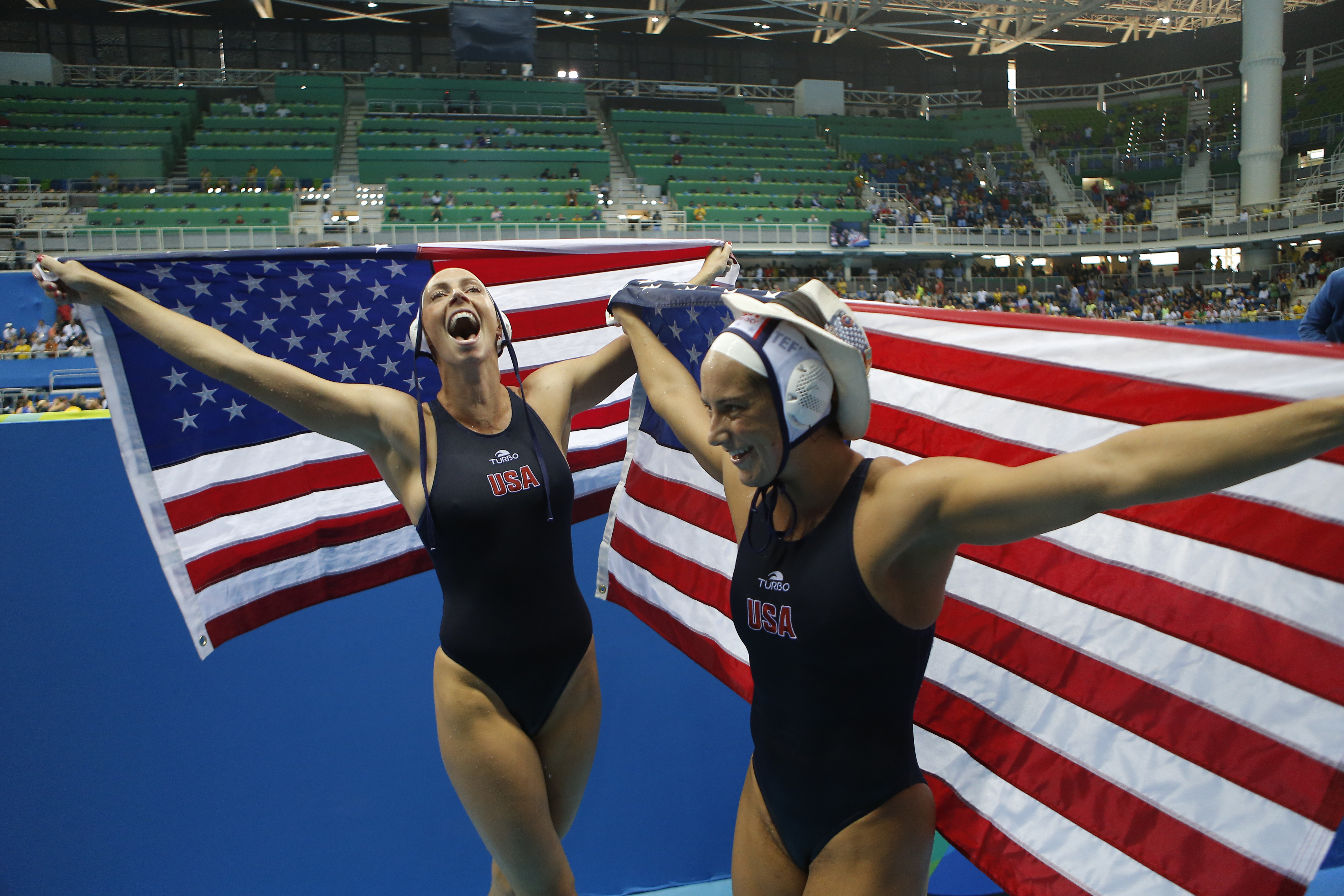Members of the United States women's water polo team celebrate after winning the gold medal match against Italy at the 2016 Summer Olympics in Rio de Janeiro, Brazil, Friday, Aug. 19, 2016. (AP Photo/Eduardo Verdugo)