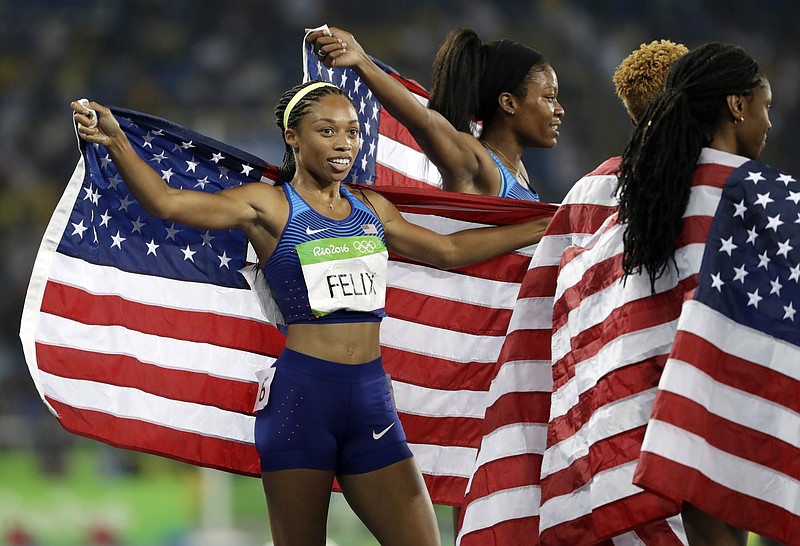 United States' Allyson Felix celebrates with her teammates after winning the gold medal in the women's 4x400-meter relay final during the athletics competitions of the 2016 Summer Olympics at the Olympic stadium in Rio de Janeiro, Brazil, Saturday, Aug. 20, 2016. (AP Photo/David J. Phillip)