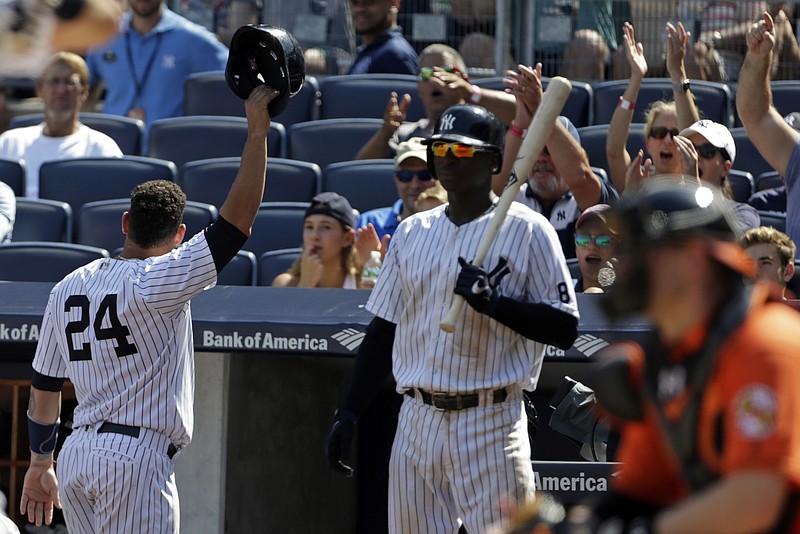 
              New York Yankees' Gary Sanchez (24) takes a curtain call after hitting a solo home run during the fourth inning of a baseball game against the Baltimore Orioles on Saturday, Aug. 27, 2016, in New York. (AP Photo/Adam Hunger)
            