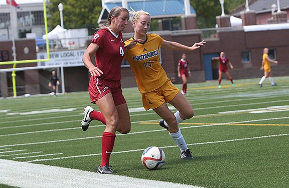 UTC's Masey Fox, right, battles for control of the ball with Alabama's Nealy Martin during Sunday's game at Finley Stadium. The Crimson Tide beat the Mocs 1-0.