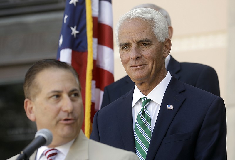 
              In this Aug. 17, 2016 photo, former Florida Gov. Charlie Crist, right, listens to St. Petersburg Mayor Rick Kriseman during a news conference in St. Petersburg, Fla. Crist is running as a democrat for the U.S. House of Representatives for the 13th District in Florida. (AP Photo/Chris O'Meara)
            