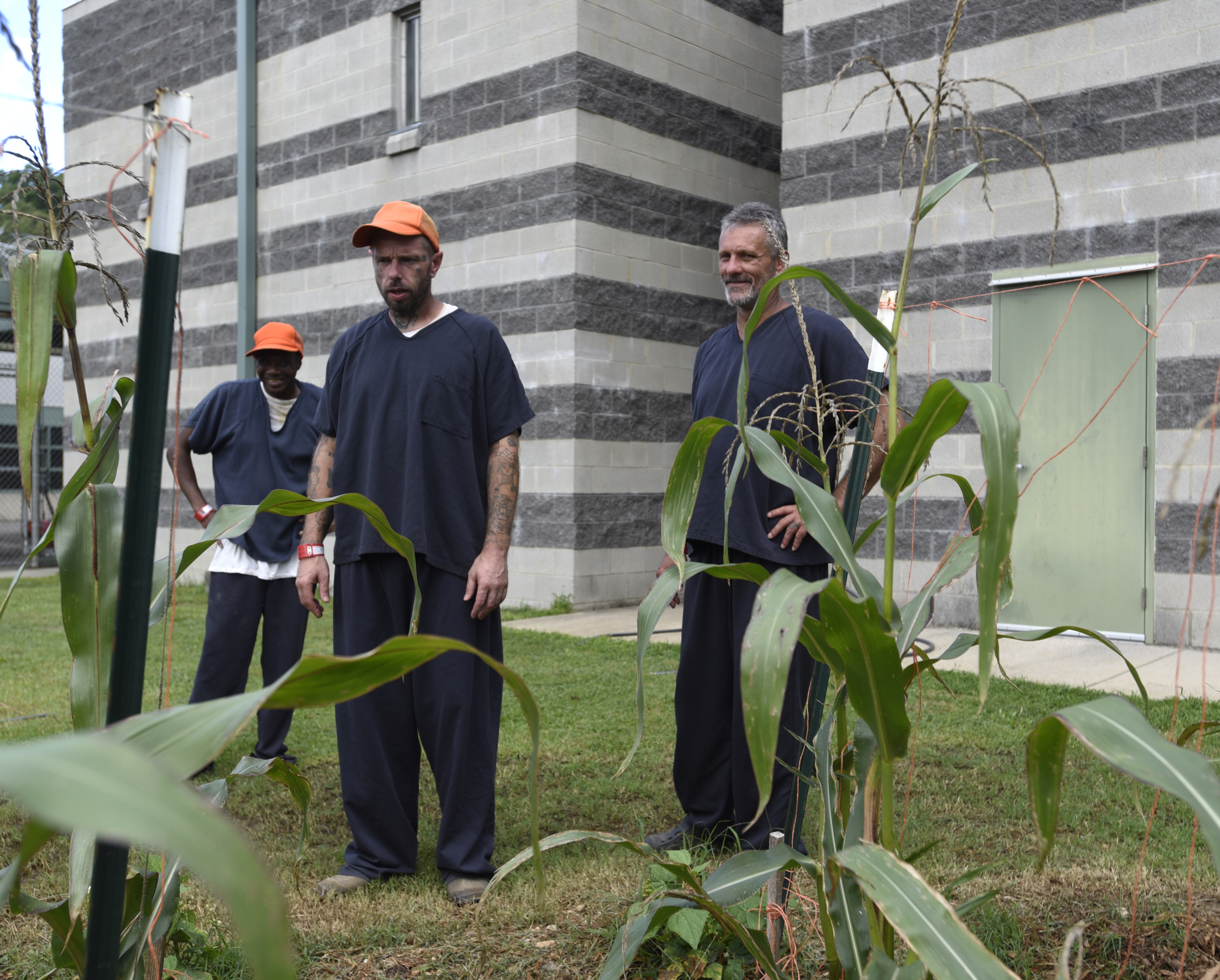 Leander Johnson, Jason Hughes and Tim Kelly, from left, discuss the work they put into it at the Catoosa County Jail.
