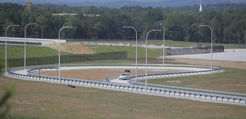 Staff file photo by Jake Daniels / A Passat sedan goes around part of the test track at VW's Chattanooga plant. VW has plans to expand the track so it can test the new SUVs which the company plans to start assembling later this year.