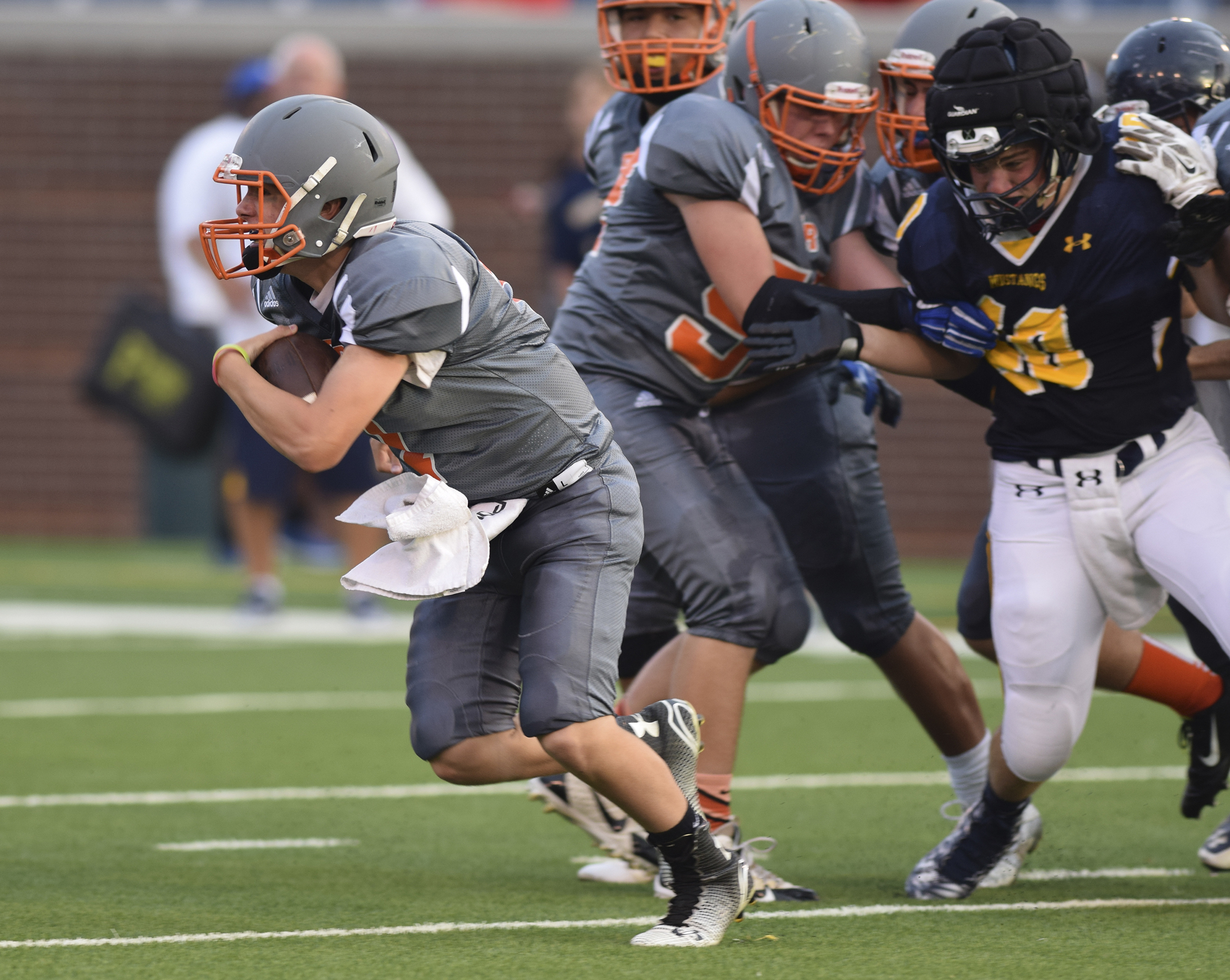 East Ridge quarterback Eric Bennett keeps the ball. The second night of the Chick-Fil-A High School Football Jamboree was played at Finley Stadium Saturday night.