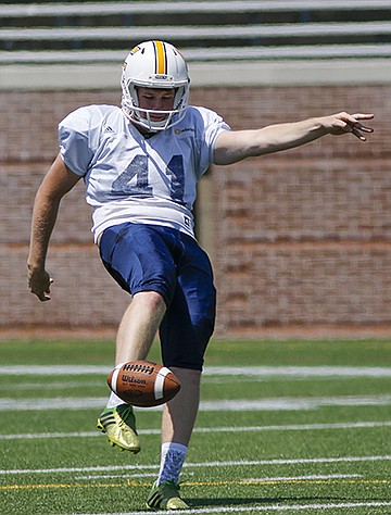 White team kicker Colin Brewer punts during the UTC spring football game at Finley Stadium on Saturday, April 23, 2016, in Chattanooga, Tenn.