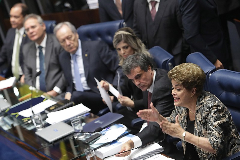 
              Brazil's suspended President Dilma Rousseff speaks at her own impeachment trial, in Brasilia, Brazil, Monday, Aug. 29, 2016. Fighting to save her job, Rousseff told senators on Monday that the allegations against her have no merit. "I know I will be judged, but my conscience is clear. I did not commit a crime," she told senators. Rousseff's address comes on the fourth day of the trial. (AP Photo/Eraldo Peres)
            