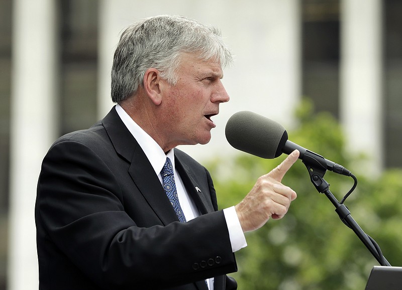 
              FILE - In this Thursday, Aug. 25, 2016 file photo, the Rev. Franklin Graham speaks during an election prayer rally outside the state Capitol in Albany, N.Y. Graham is scheduled to hold a mass prayer rally as part of a 50-state tour to urge evangelicals to vote, Tuesday, Aug. 30, 2016, on Boston Common. (AP Photo/Mike Groll, File)
            