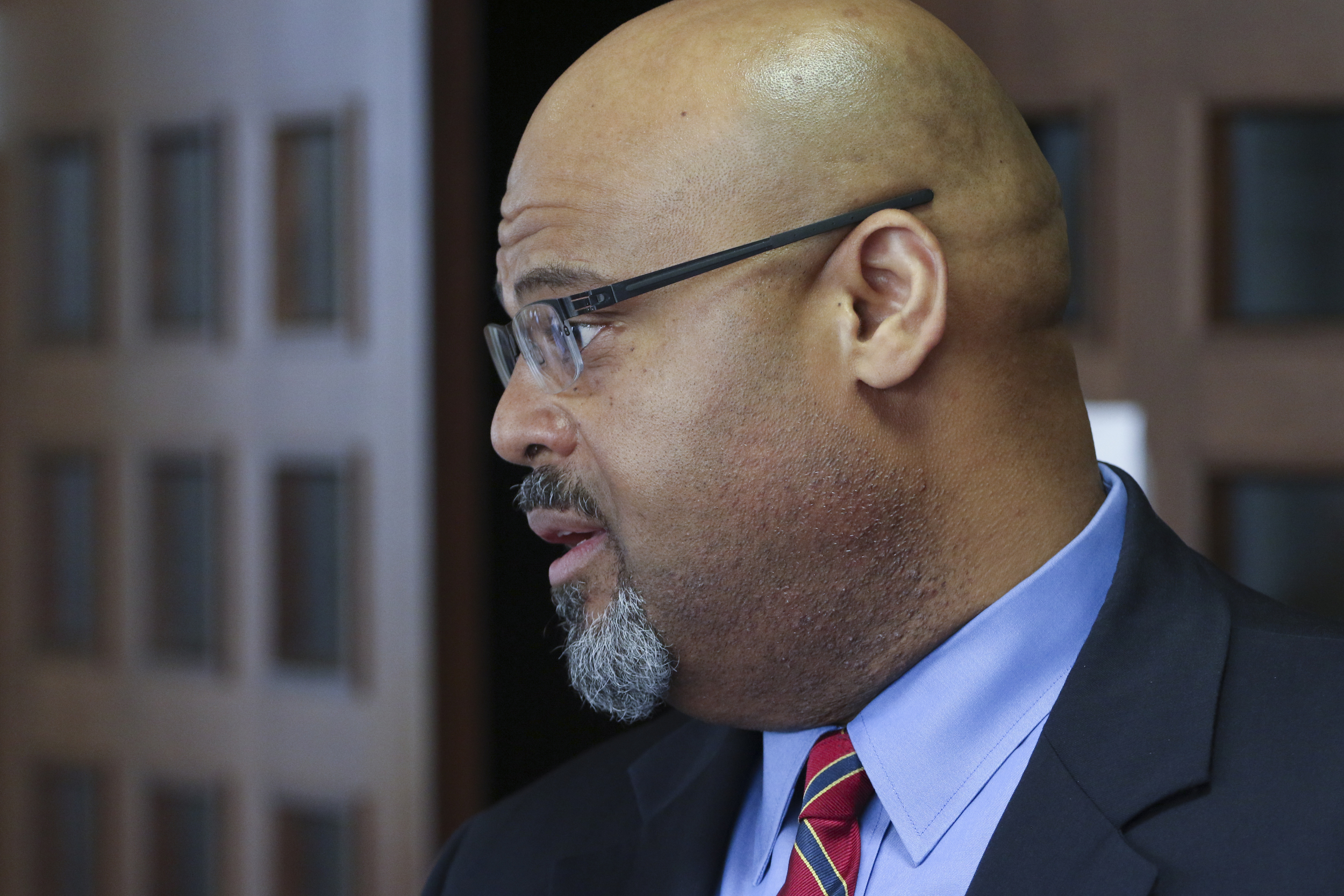 Staff Photo by Dan Henry / The Chattanooga Times Free Press- 8/31/16. Attorney Curtis Bowe, right, speaks briefly about his case defending former Ooltewah High School head basketball coach Andre "Tank" Montgomery who appeared before Judge Don Poole on August 31, 2016 on charges of failure to report child sexual abuse.
