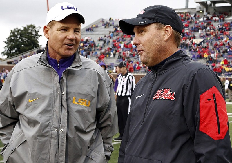 LSU's Les Miles, left, and Mississippi's Hugh Freeze are among the Southeastern Conference football coaches who will open the season with top-billed neutral-site games over the next few days.