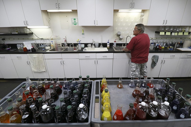 Staff Photo by Dan Henry / The Chattanooga Times Free Press- 8/8/16. Michael Bondi works in the dye lab while at Polartec's new Cleveland, Tennessee, textile plant on Monday, August 8, 2016.