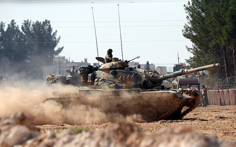 
              Turkish tanks head towards the Syrian border, in Karkamis, Turkey, Wednesday Aug. 31, 2016. Turkey on Wednesday dismissed reports of a cease-fire deal with Kurdish rebels in northern Syria, and vowed to continue its week-old military incursion into the neighboring country until all "terror entities are eliminated." Prime Minister Binali Yildirim said Wednesday that military "operations will continue until all terrorist elements have been neutralized, until all threats to our borders, our lands and our citizens are completely over. " (Ismail Coskun, IHA via AP)
            