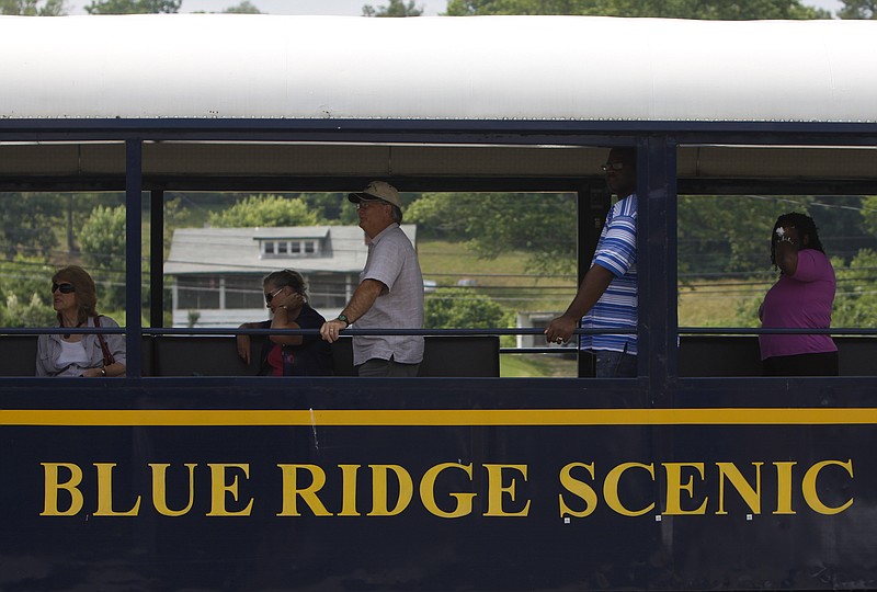 Staff photo by Dan Henry/Chattanooga Times Free Press - 6/09/11. Passengers ride the Blue Ridge Scenic Railway after returning from a four-hour round trip to Copper Hill, Tenn., and McCaysville, Ga. from Blue Ridge, Ga., Thursday afternoon.