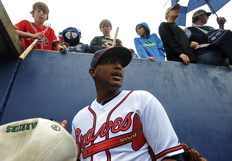 Atlanta Braves pitcher Julio Teheran signs autographs before a 2014 exhibition game against the franchise's minor league "Future Stars" at State Mutual Stadium in Rome. The ballpark is home to the Class A Rome Braves, who play in the South Atlantic League.