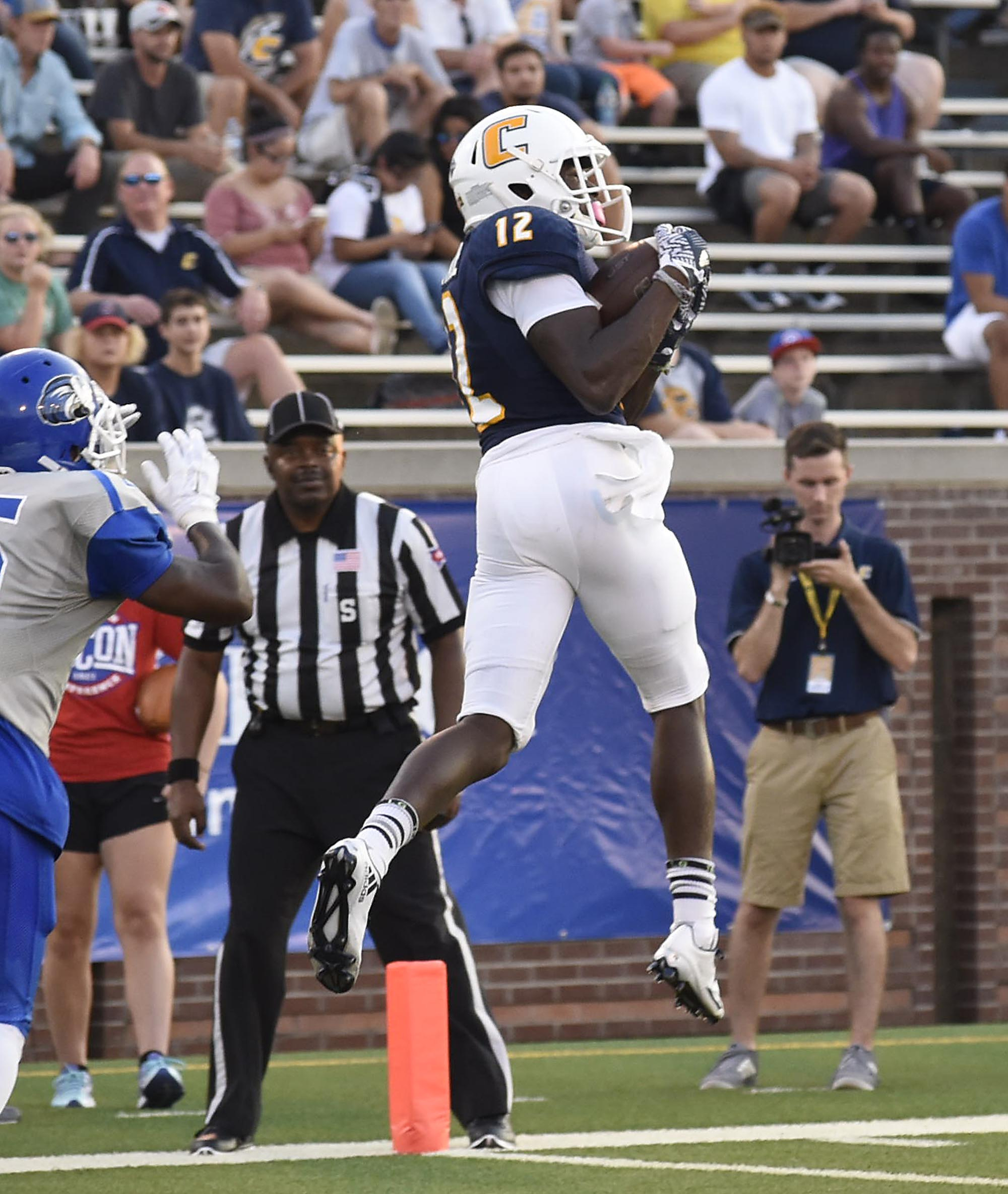UTC's Xavier Borishade (12) pulls in a pass for a touchdown. The University of Tennessee/Chattanooga Mocs hosted the Shorter University Hawks in NCAA football action on Sept. 1, 2016.
