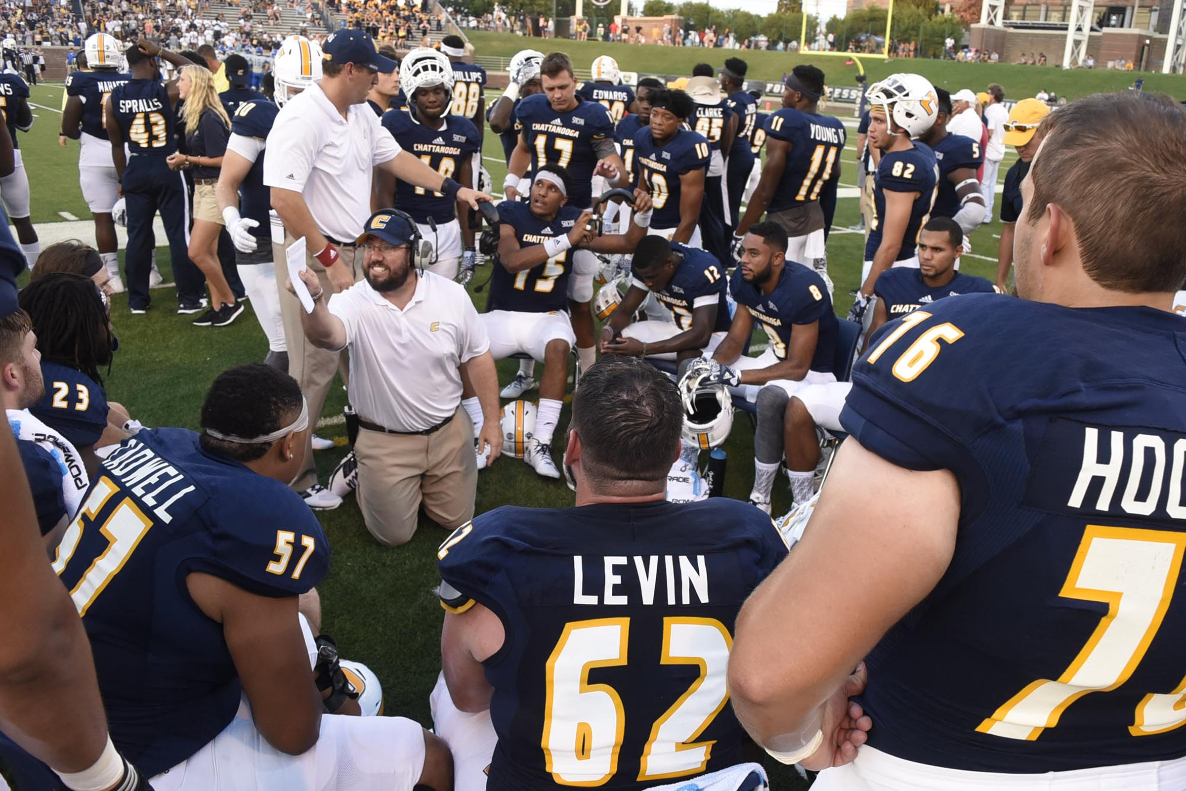 UTC offensive line coach Adam Duncan instructs the offense between series. The University of Tennessee/Chattanooga Mocs hosted the Shorter University Hawks in NCAA football action on Sept. 1, 2016.