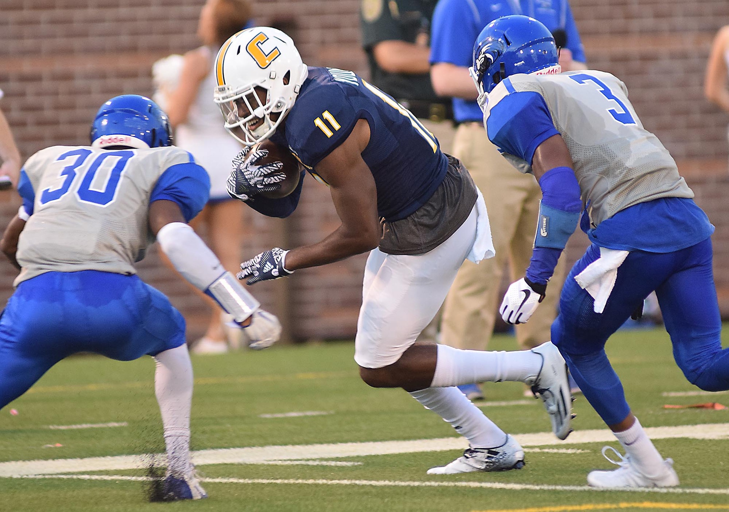 UTC's Wil Young (11) picks up yardage after a pass reception deep in Shorter territory. The University of Tennessee/Chattanooga Mocs hosted the Shorter University Hawks in NCAA football action on Sept. 1, 2016.