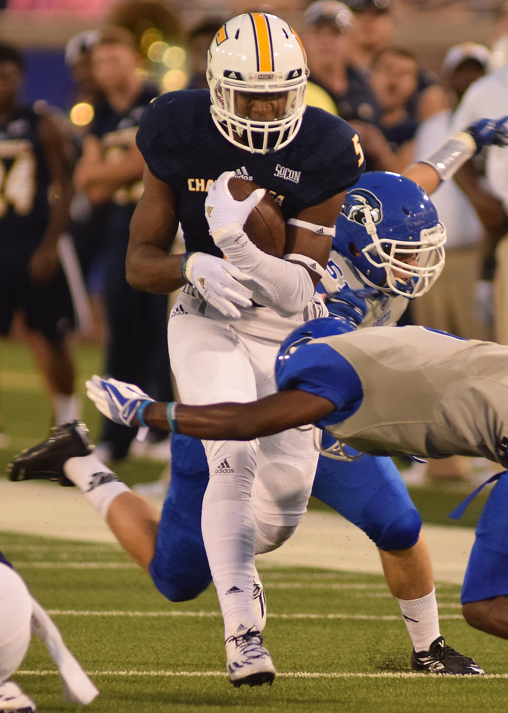 UTC's Bingo Morton (5) picks up yards outside after a pass reception. The University of Tennessee/Chattanooga Mocs hosted the Shorter University Hawks in NCAA football action on Sept. 1, 2016.