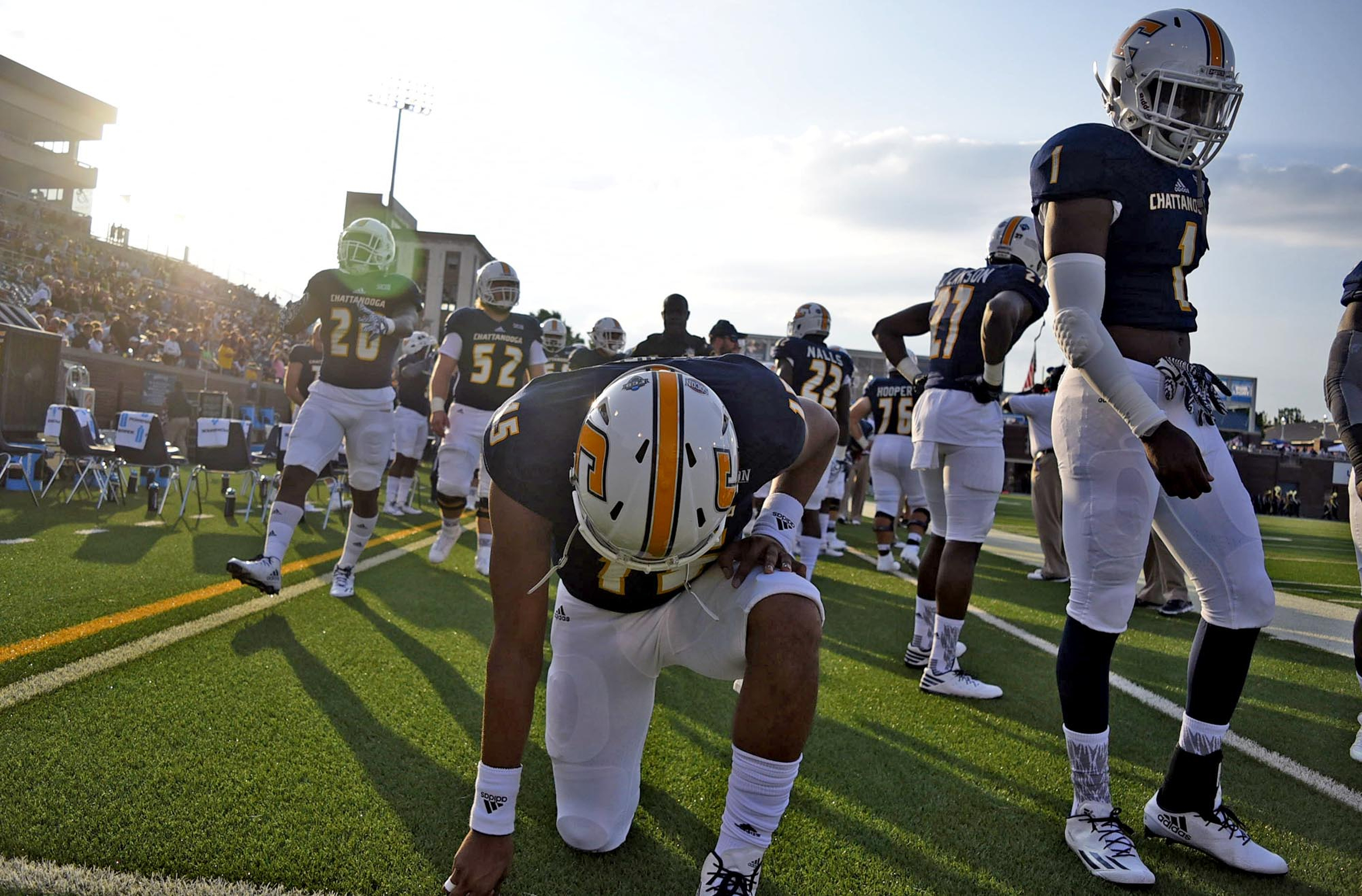 UTC quarterback Alejandro Bennifield (15) takes a knee before the start of the game. The University of Tennessee/Chattanooga Mocs hosted the Shorter University Hawks in NCAA football action on Sept. 1, 2016.