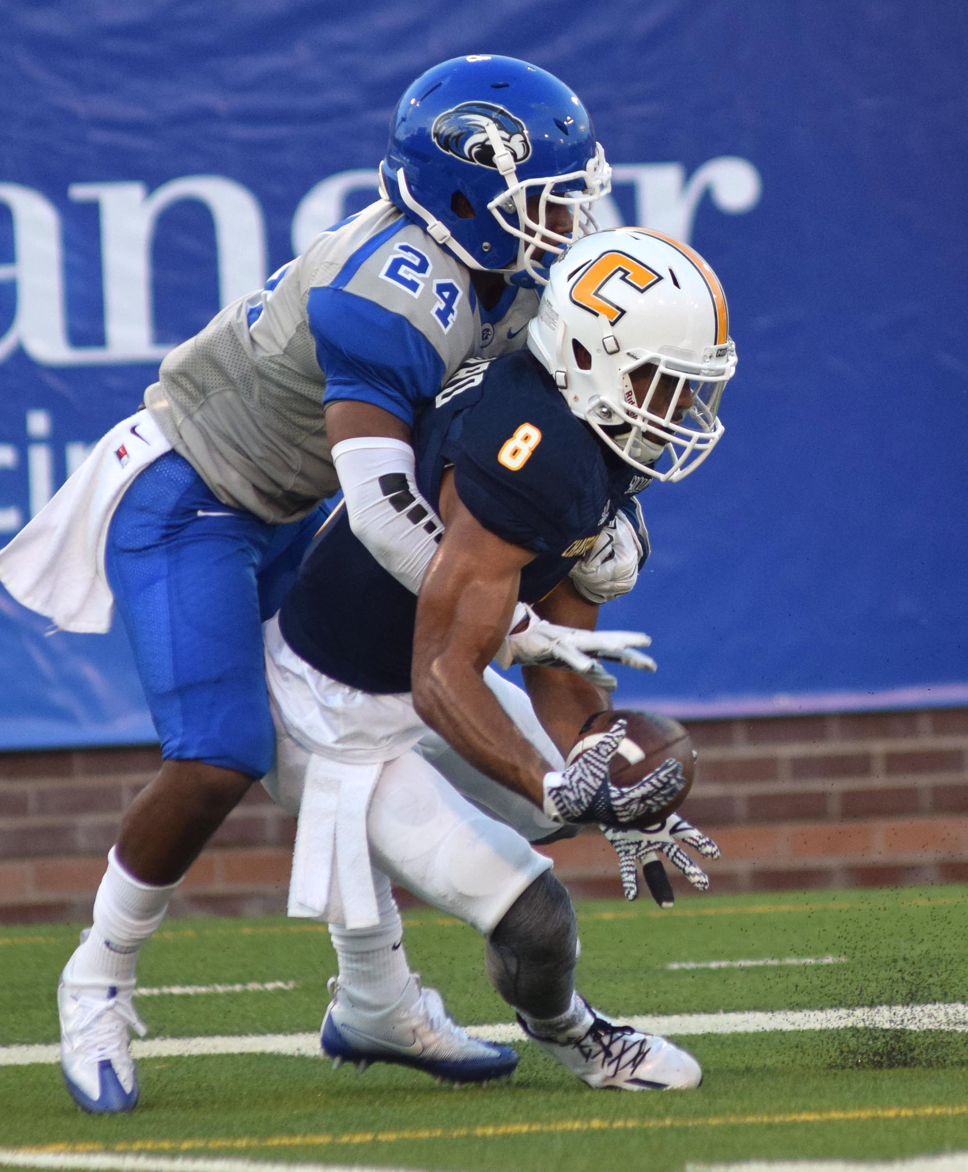 UTC's C.J. Board (8) struggles to catch a pass. Shorter's Josh Kimble (24) was called for interference on the play. The University of Tennessee/Chattanooga Mocs hosted the Shorter University Hawks in NCAA football action on Sept. 1, 2016.