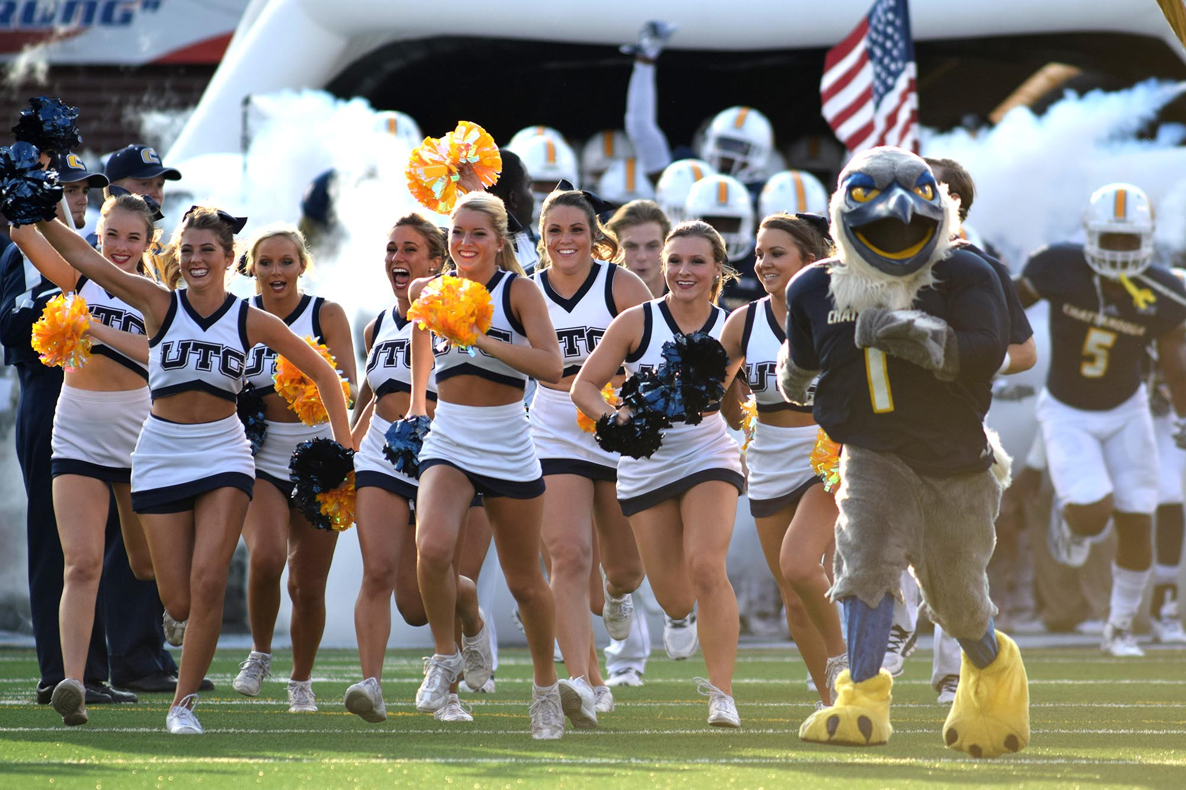 The Moc cheerleaders lead the team onto the field. The University of Tennessee/Chattanooga Mocs hosted the Shorter University Hawks in NCAA football action on Sept. 1, 2016.