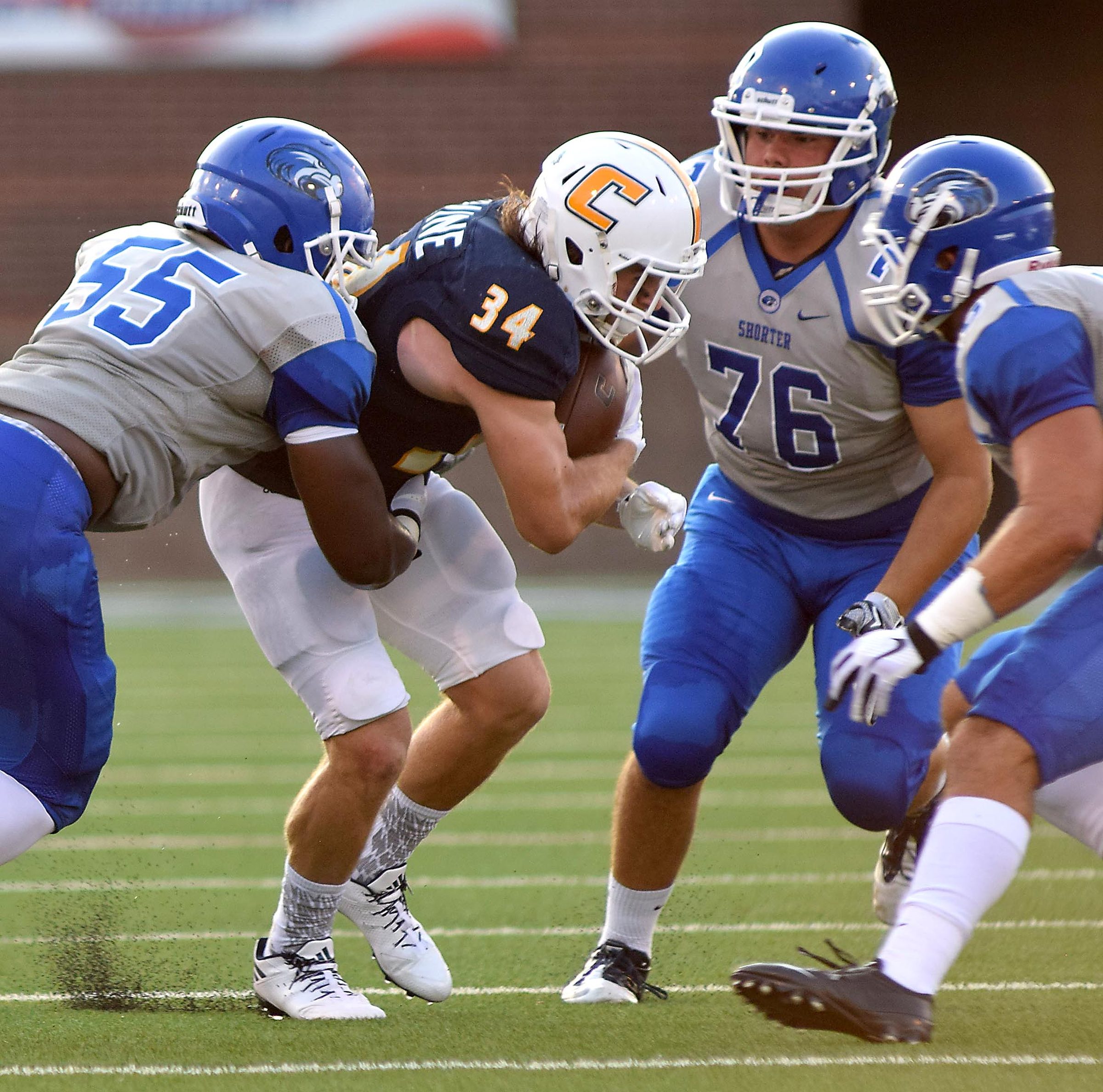 UTC's Derrick Craine (34) is surrounded by the Shorter defense. The University of Tennessee/Chattanooga Mocs hosted the Shorter University Hawks in NCAA football action on Sept. 1, 2016.