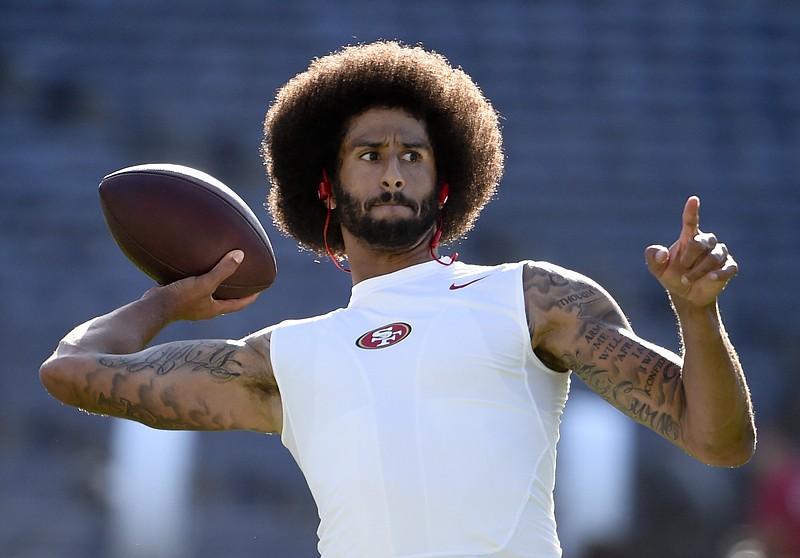 
              San Francisco 49ers quarterback Colin Kaepernick warms up for the team's NFL preseason football game against the San Diego Chargers, Thursday, Sept. 1, 2016, in San Diego. (AP Photo/Denis Poroy)
            