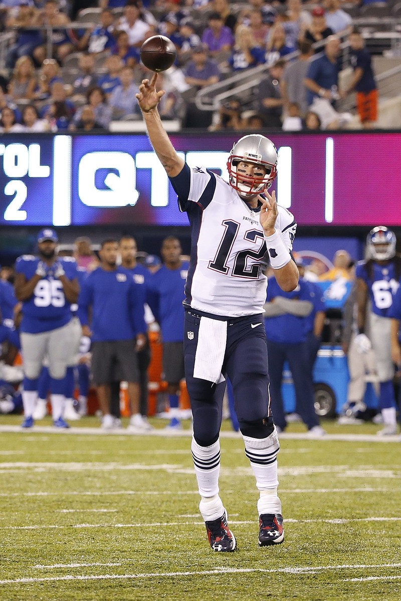 
              New England Patriots quarterback Tom Brady throws a pass to Keshawn Martin for a touchdown during the first half of a preseason NFL football game against the New York Giants on Thursday, Sept. 1, 2016, in East Rutherford, N.J. (AP Photo/Kathy Willens)
            