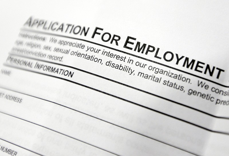 
              FILE - This April 22, 2014, file photo shows an employment application form on a table during a job fair at Columbia-Greene Community College in Hudson, N.Y. The Labor Department released its weekly report on applications for unemployment benefits on Thursday, Sept. 1, 2016. Slightly more Americans sought unemployment benefits during the previous week, but the overall levels still remain near historic lows in a positive sign for the job market. (AP Photo/Mike Groll, File)
            