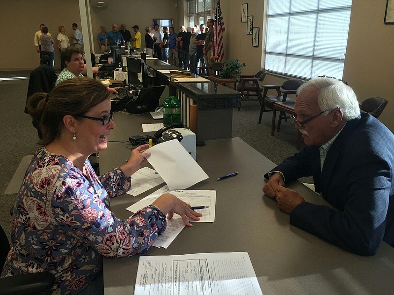 Joe Smith, right, applies for candidacy at the Hamilton County Elections Office.