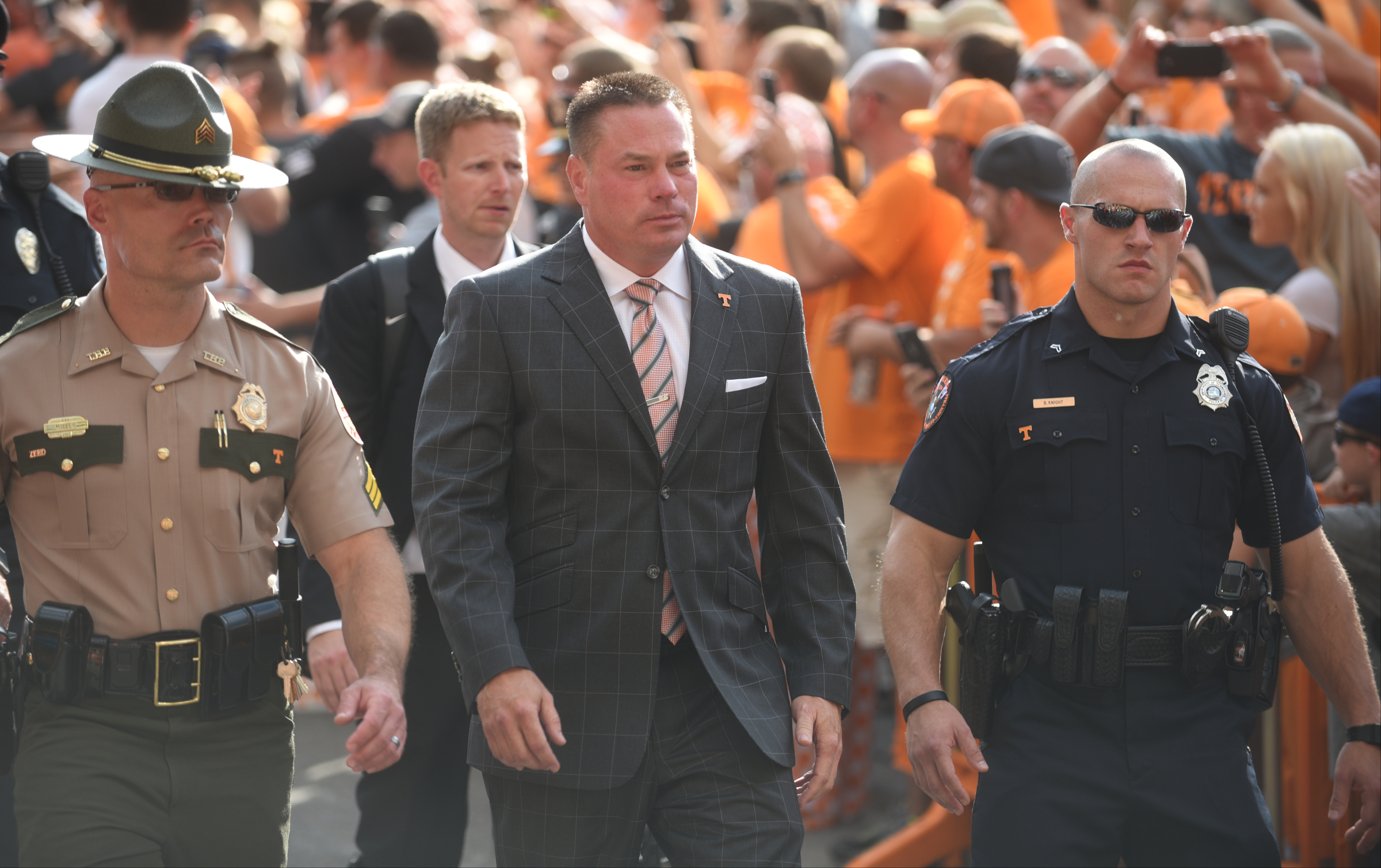 Coach Butch Jones is escorted in during the Vol Walk Thursday, Sept. 1, 2016 outside of Neyland Stadium before the game against Appalachian State.