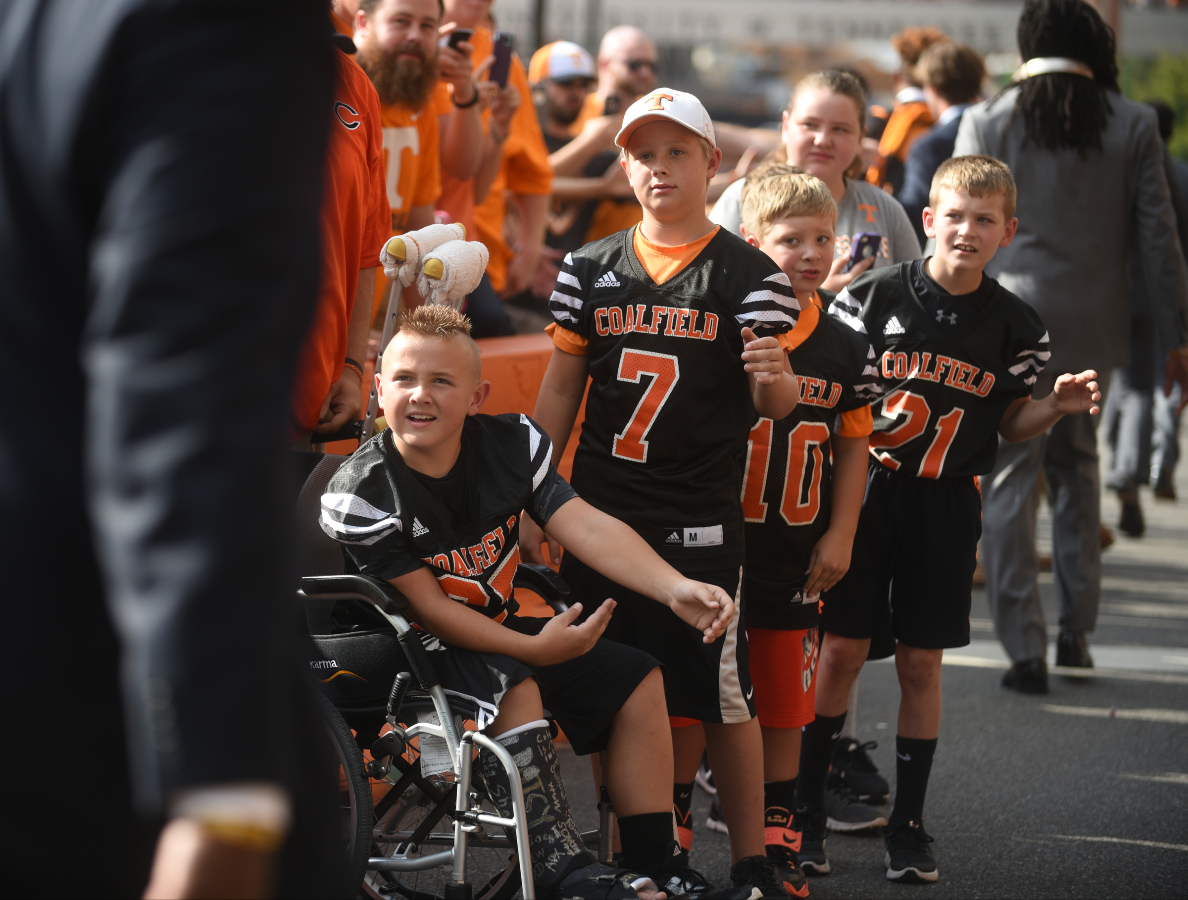 Kids watch players arrive during the Vol Walk Thursday, Sept. 1, 2016 outside of Neyland Stadium before the game against Appalachian State.