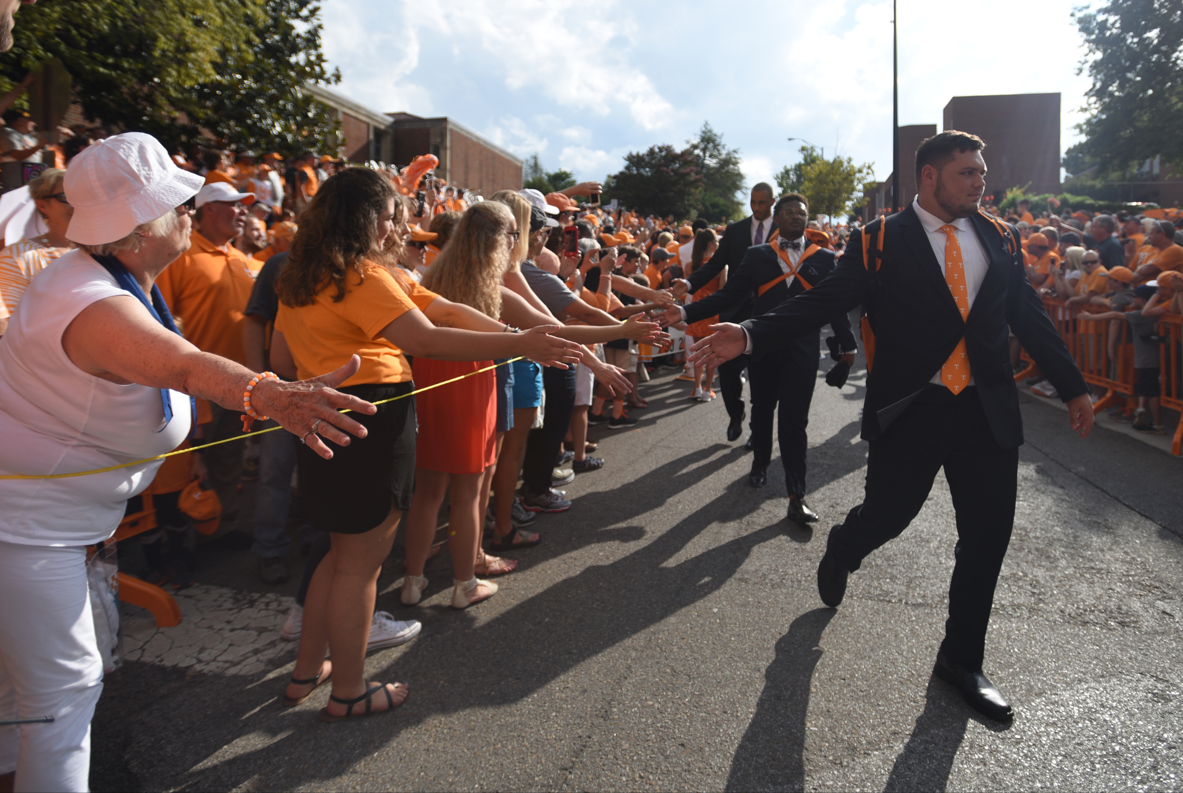 Players walk past fans during the Vol Walk Thursday, Sept. 1, 2016 outside of Neyland Stadium before the game against Appalachian State.