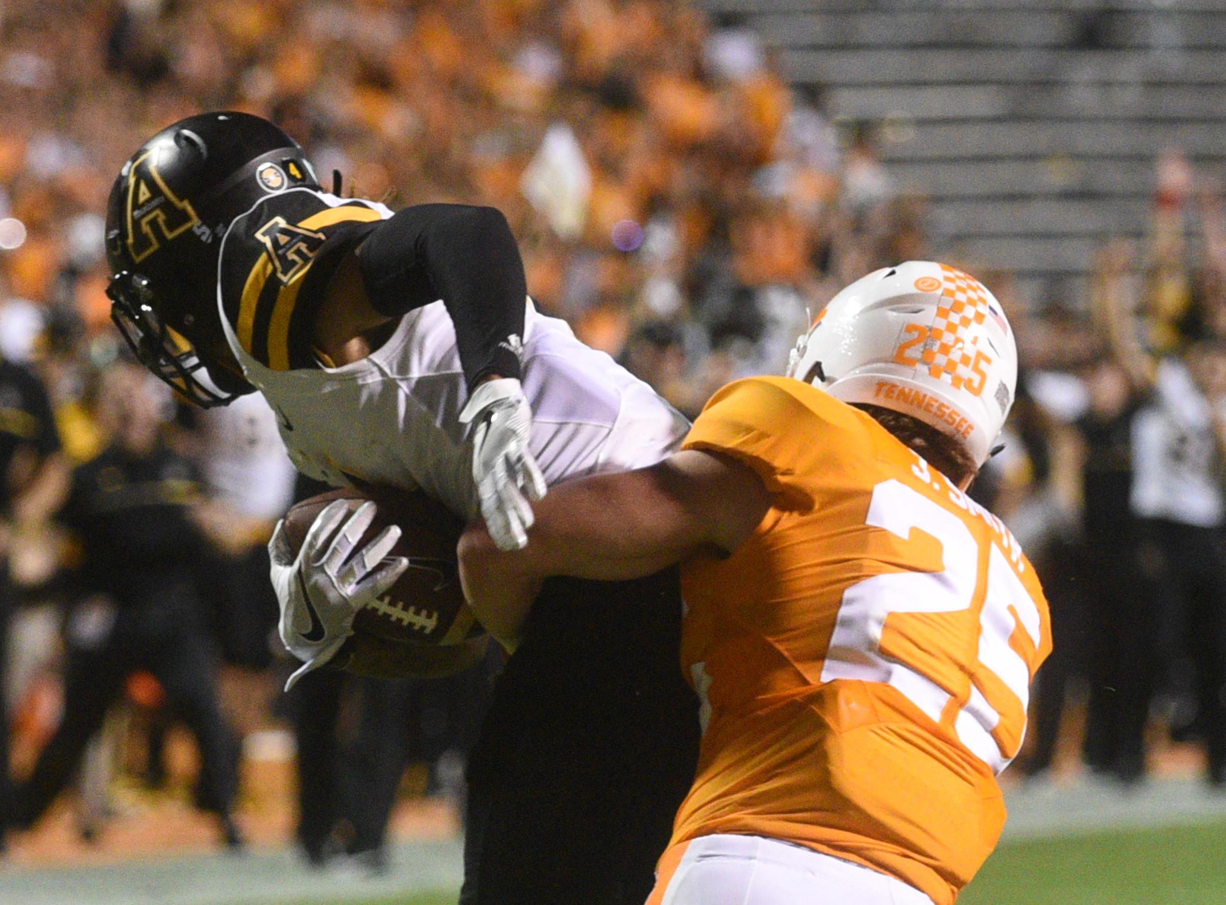 UT's Josh Smith (25) tackles Appalachian State's Mondo Williams (4) after Williams intercepted a ball meant for Smith Thursday, Sept. 1, 2016 in Neyland Stadium.