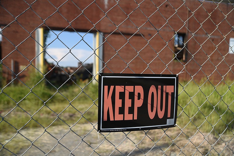 Rubble remains at the old Barwick Mills site in LaFayette, Ga., Wednesday, August 31, 2016 after it burned last fall.