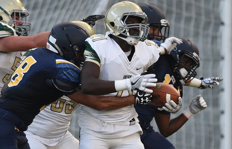 Notre Dame's Caleb Edwards tries to escape Chattanooga Christian's defense during Friday night's game at Charger Stadium. The Fighting Irish won 53-7.