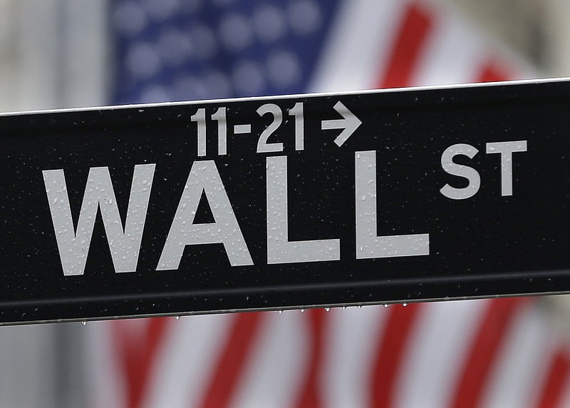
              This July 9, 2015 photo shows a Wall Street sign near the New York Stock Exchange in New York.  Stock rose and the dollar fell on Friday, Sept. 2, 2016,  after a key report showed the U.S. economy added slightly fewer jobs than expected in August, making it potentially less likely that the Federal Reserve will raise interest rates already this month. (AP Photo/Seth Wenig)
            