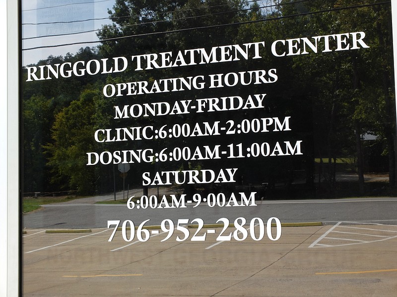 Open days and times are posted on the front door of a pain medicine clinic in Ringgold. The building is located at 8292 Highway 41, just south of downtown.