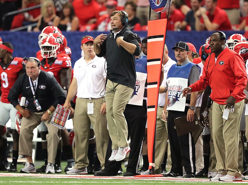 Georgia head coach Kirby Smart gets some air coaching in his first game for the team against North Carolina during the first quarter of an NCAA college football game in Atlanta, Saturday, Sept. 3, 2016. (Curtis Compton/Atlanta Journal-Constitution via AP)