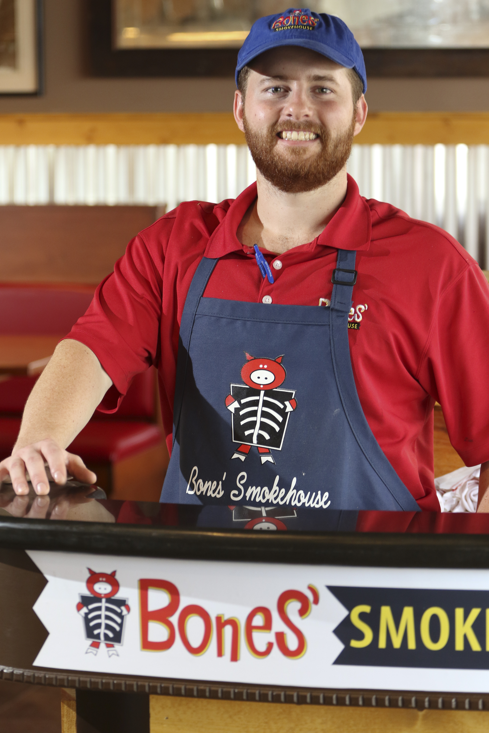 Restaurant manager Jeffrey Hennen stands in the new location of Bones Smokehouse at 7601 E. Brainerd Road.
