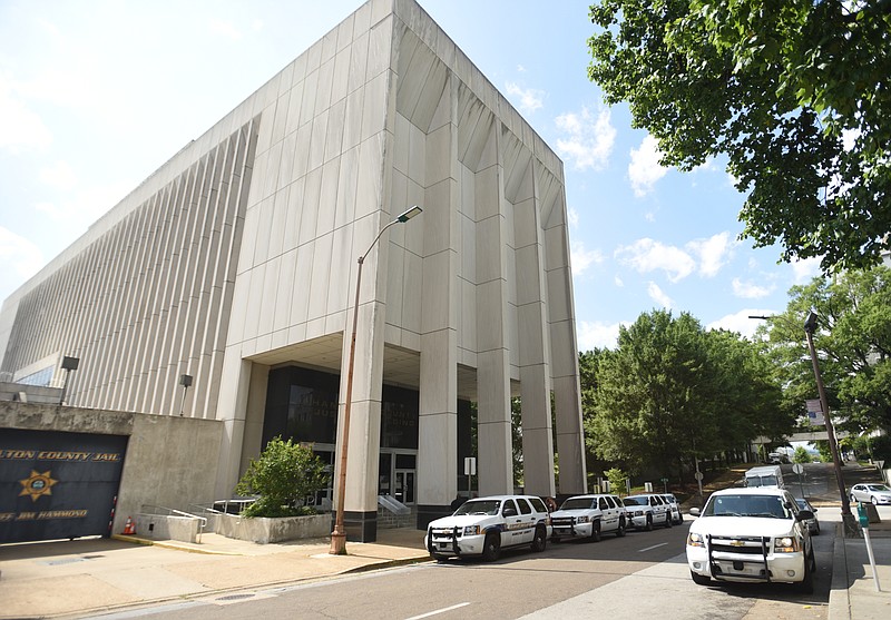 Police vehicles line the street Wednesday, June 15, 2016, outside of the Hamilton County Jail.