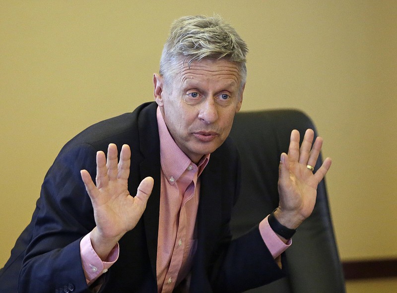 
              FILE - In this May 18, 2016 file photo, Libertarian presidential candidate, former New Mexico Gov. Gary Johnson speak with legislators at the Utah State Capitol in Salt Lake City. If Hillary Clinton carries Arizona in November, there’s a good chance it won’t be because the Democratic Party alone has picked off a reliably red state it believes will someday be consistently blue. Instead, she may have Gary Johnson to thank. The Libertarian Party nominee’s best chance to impact the 2016 presidential race may well be in Arizona, a traditionally Republican state where he appeals to a group of finicky conservatives who make up part of the party’s base.  (AP Photo/Rick Bowmer, File)
            